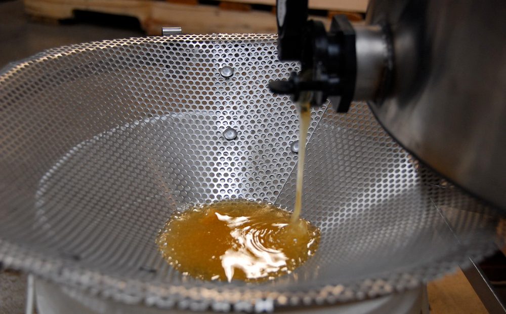 my extractor mid-spin, or honey running out the gate through the strainer into the bucket (placeholder)