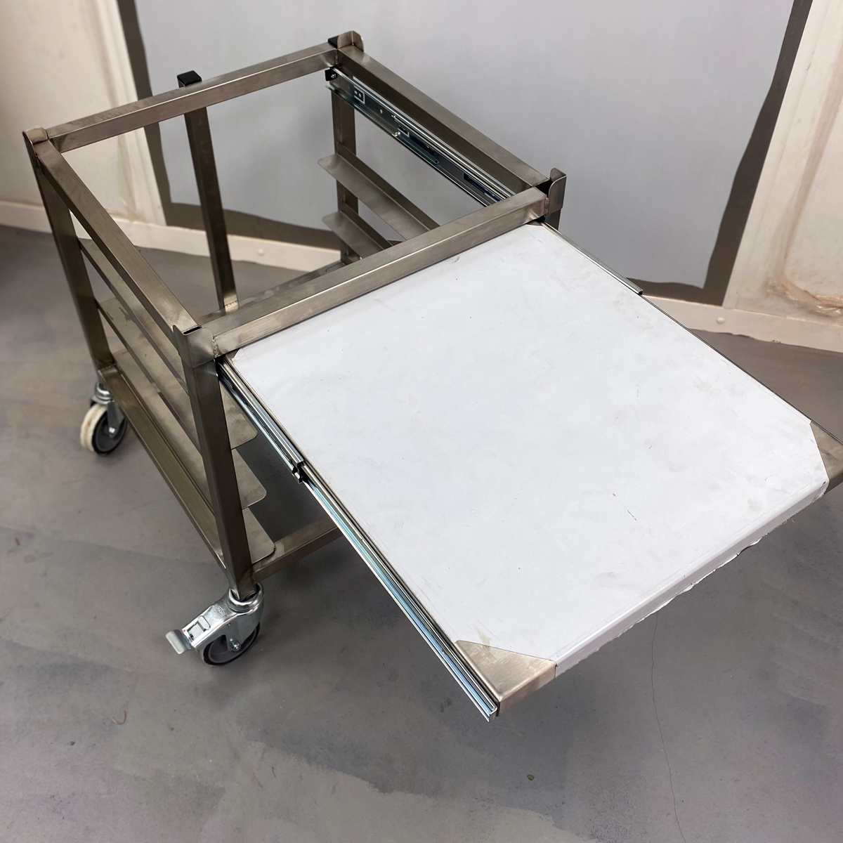 A B40 set up on a stainless stand at a comfortable working height in a small bakery