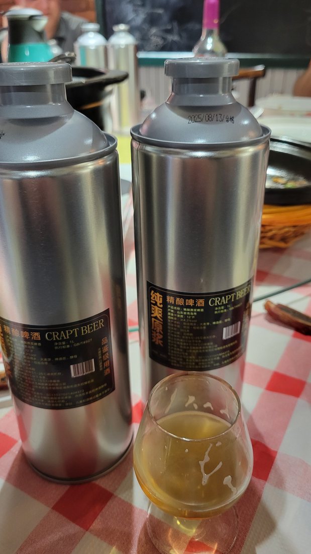 Craft beer in steel growlers on the red check