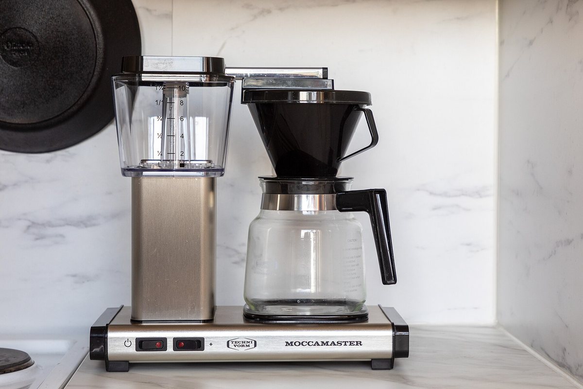 A Technivorm Moccamaster — one of the SCA-certified machines: a heater that actually reaches brew temperature and a showerhead that wets the whole bed. This one came with the glass carafe and hot plate; the thermal-carafe version is the one to buy