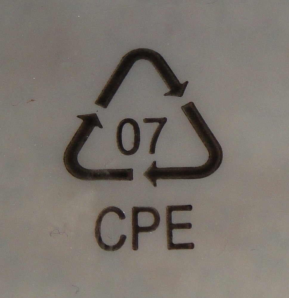 A triangle of chasing arrows stamped into grey plastic around the number 07, with the letters CPE beneath
