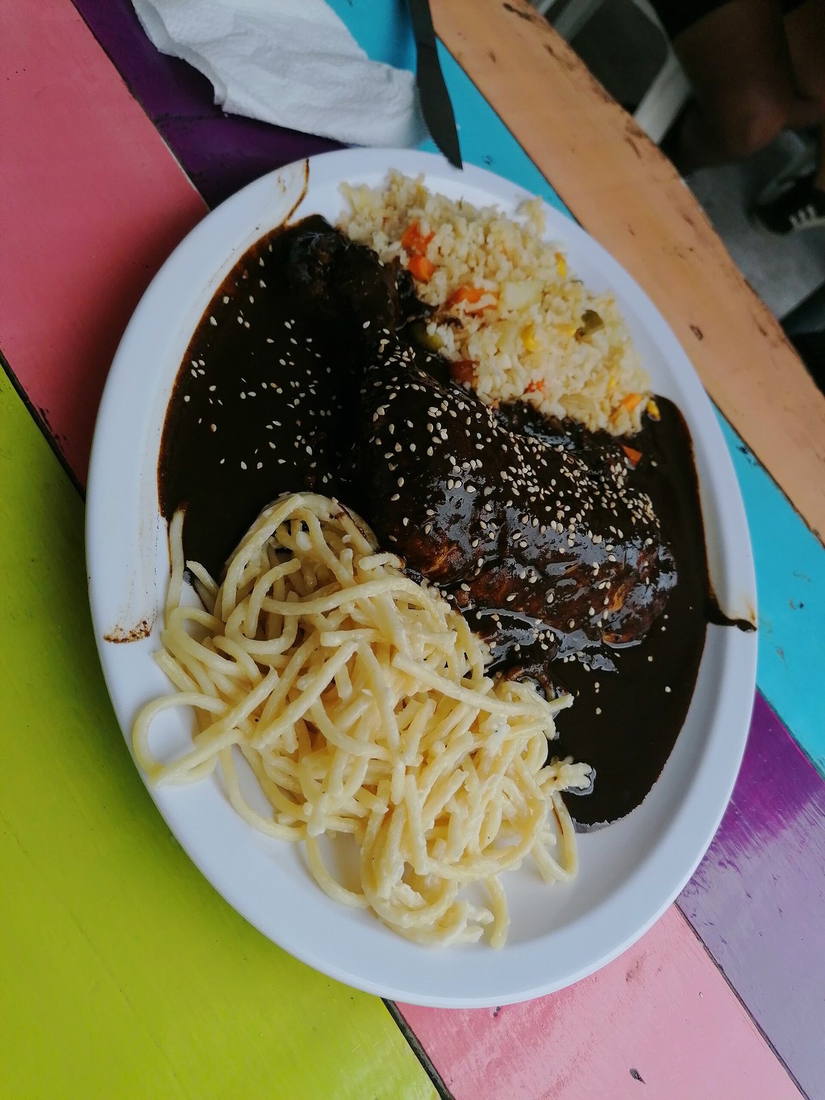 Mole. Not a coffee dish — but the same logic, and several moles do take coffee: layers of chile and chocolate and roast bitterness stacked until no single one is identifiable