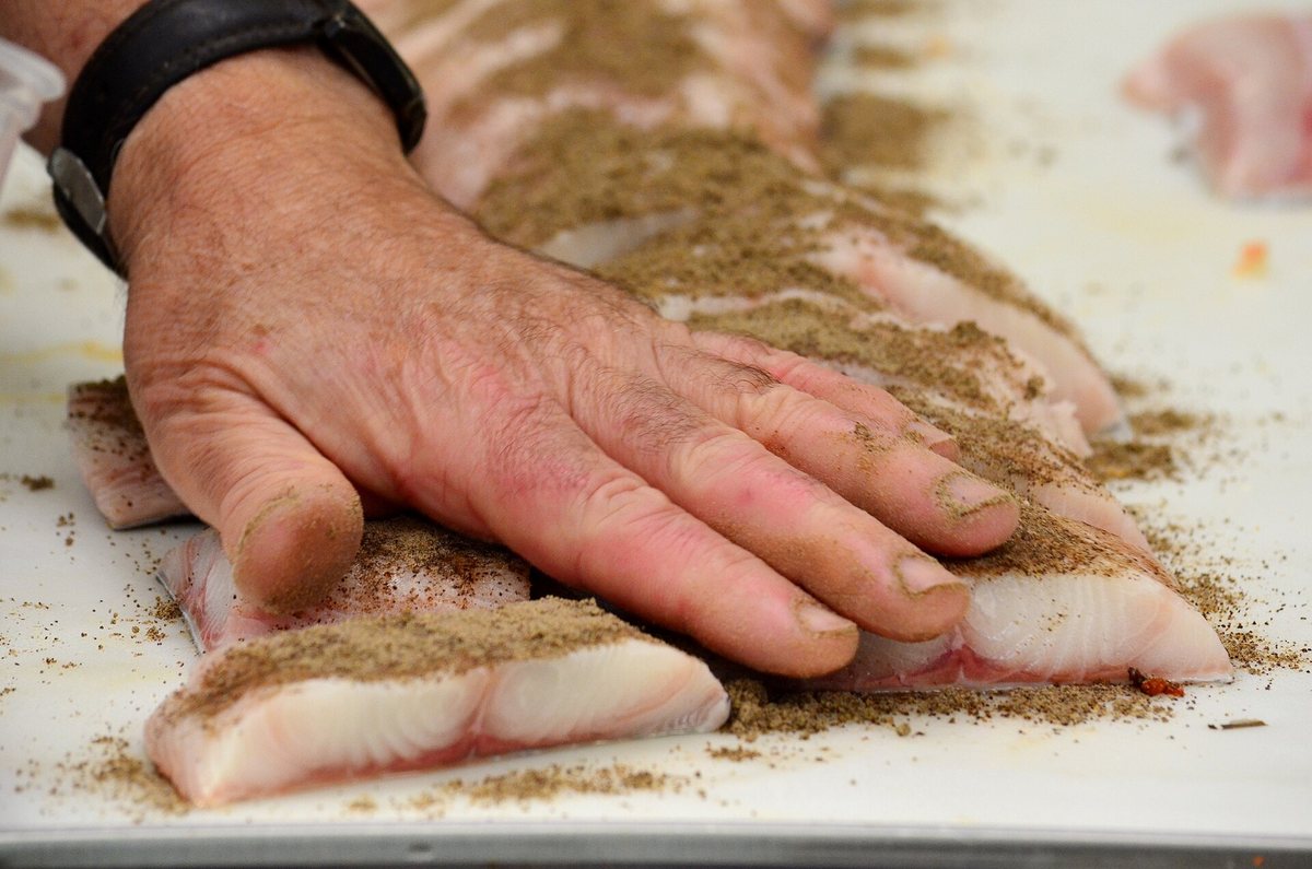 And it isn't only beef — a coffee spice rub going onto halibut. The rule is roast-and-bitter against rich, not coffee-belongs-with-cows