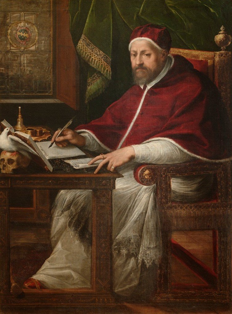 A seated pope in a red mozzetta at a writing desk, holding a quill, with books and papers around him