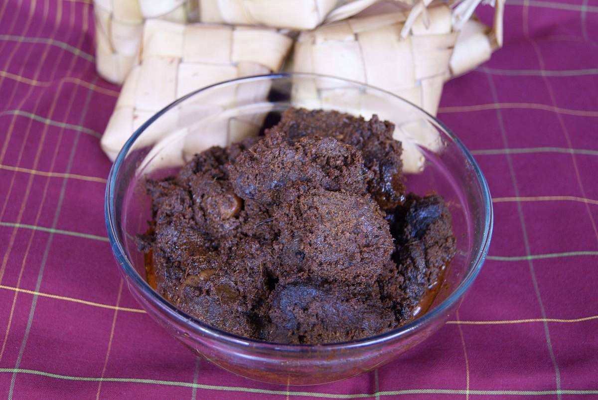 Beef rendang — dark, dry, and cooked until the coconut milk has gone entirely