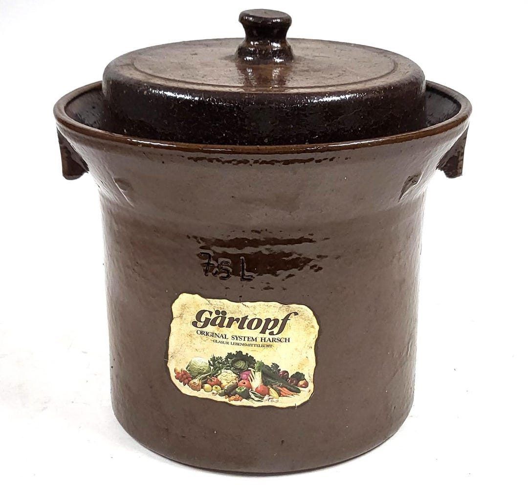 A Gärtopf with the maker's label still on it. The moat runs around the rim; the lid drops into it and the water does the rest