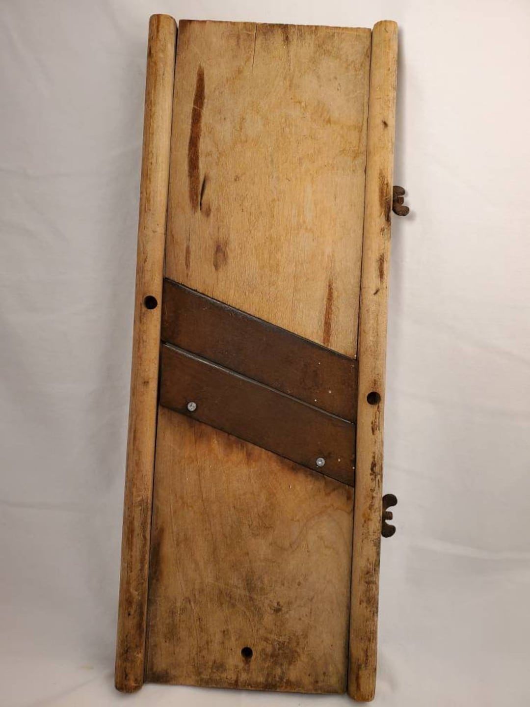 An antique cabbage board — a fixed blade in a wooden frame, the tool this job was done with for a couple of centuries