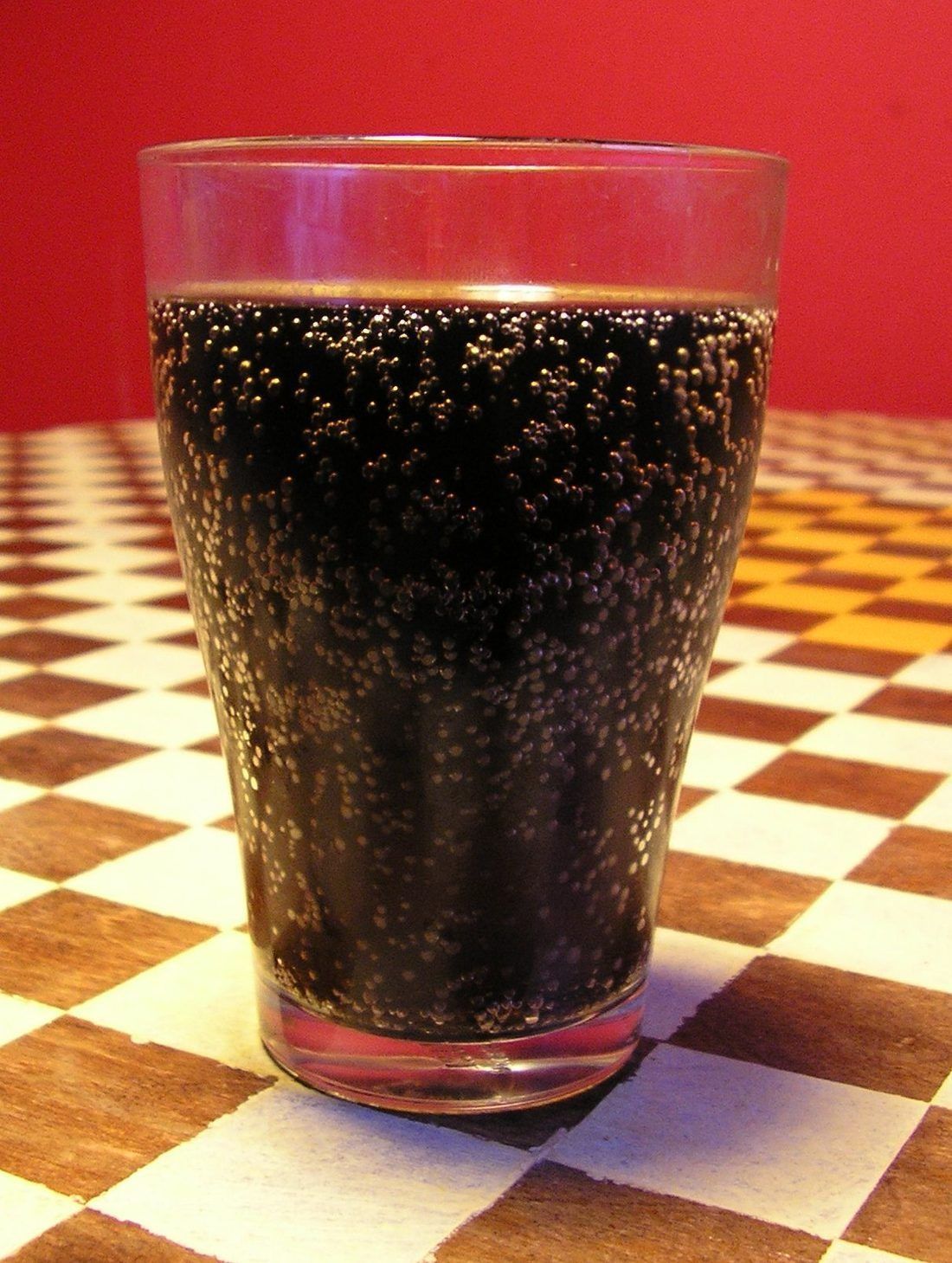 A glass of kvass — dark, faintly fizzy, and made from stale rye bread