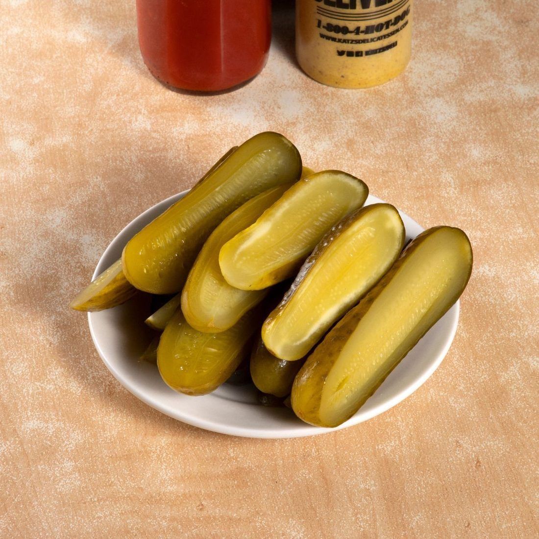Full-sour pickles: olive-drab right through, and translucent. This is what three or four weeks looks like