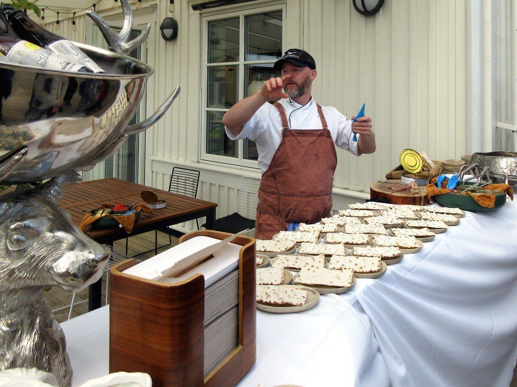 Surströmming being served with crispbread at a tasting in Sweden — a lightly-salted fermented herring, and a reminder that the risky ferments are the protein ones