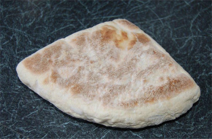 A flat griddle bread, cooked on a dry pan rather than baked