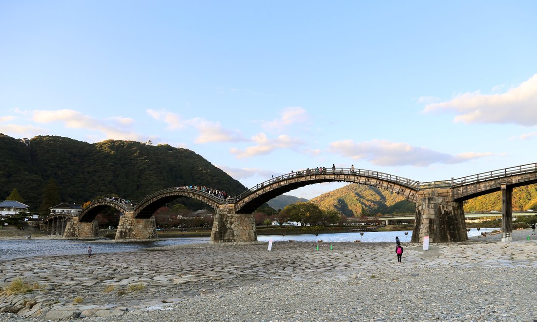 The Kintai Bridge at Iwakuni — all five wooden arches over the Nishiki River. Built 1673, destroyed by a typhoon in 1950, rebuilt to the original design by 1953