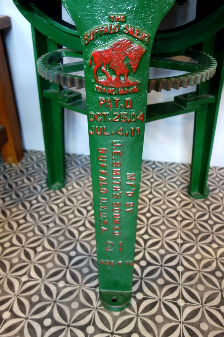 A cast-iron Buffalo silent chopper — the classic bowl cutter, its rotating bowl carrying meat past a set of fast curved knives under the guard, chopping far finer than any grinder plate can.