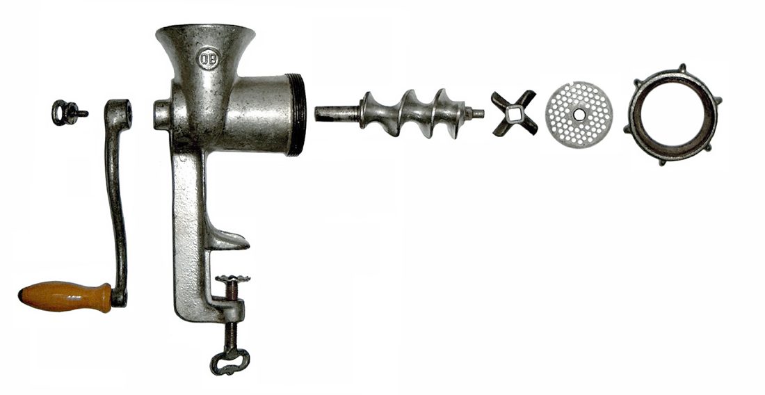A hand-crank grinder taken apart to its working pieces — the body and crank, the helical worm, the four-wing cross-knife, and the perforated plate — the same auger-knife-plate mechanism we still use today, reinvented but never really improved.