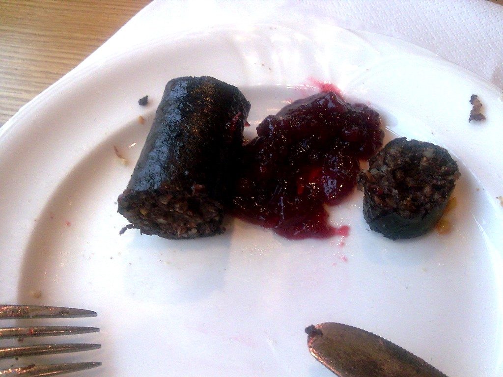 Mustamakkara with lingonberry jam — the blood sausage that is the pride of Tampere, its sweet-savory pairing the signature.