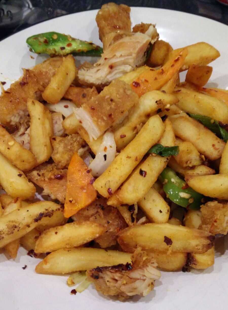 The spice bag — chips, salt-and-chili chicken and peppers in a bag, a 21st-century Irish-Chinese-takeaway invention now in the Oxford English Dictionary.