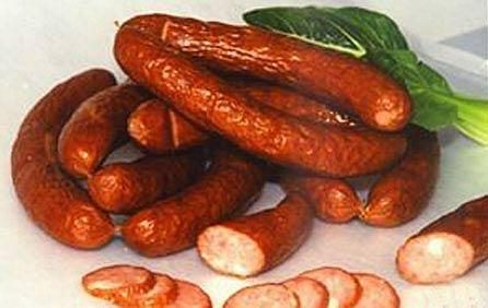 Harbin red sausage, sliced — the smoked, garlicky northern sausage whose local name, lidaosi, literally transliterates “Lithuanian.”