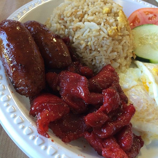 Longganisa with garlic rice and egg — the Filipino sausage, a Spanish colonial fingerprint, here in its sweet Pampanga style.