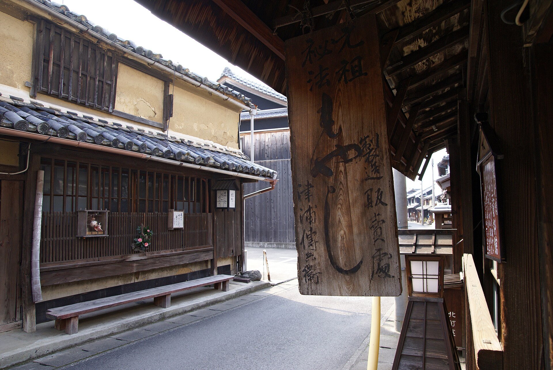 The old townscape of Yuasa, Wakayama — timber shopfronts and plastered storehouses on a narrow street