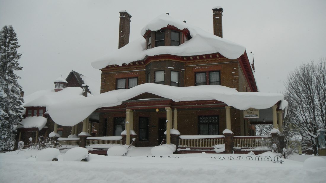 A Keweenaw house buried to the windows in deep winter snow