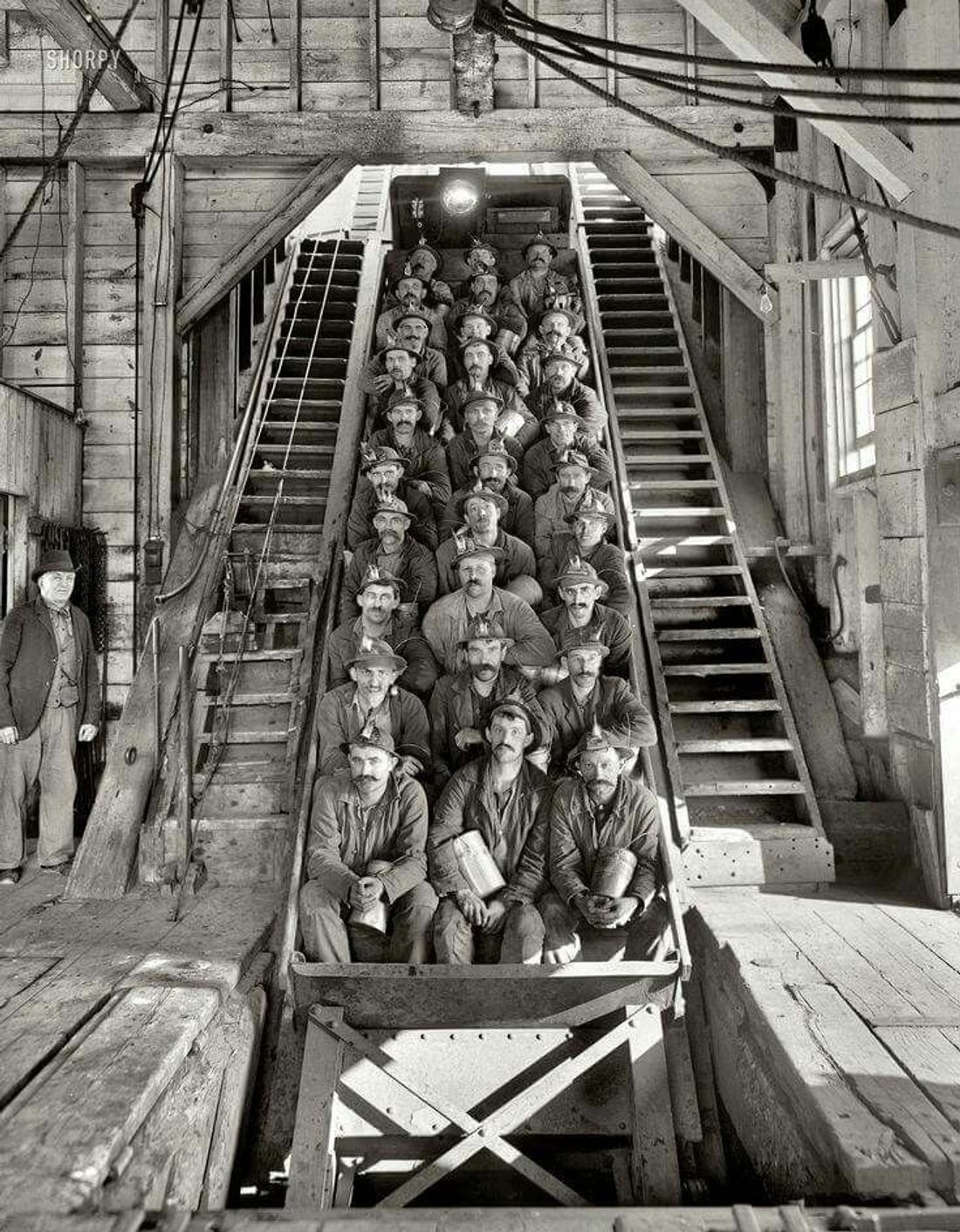 Historic photograph of a multiethnic crew of miners at a Copper Country mine