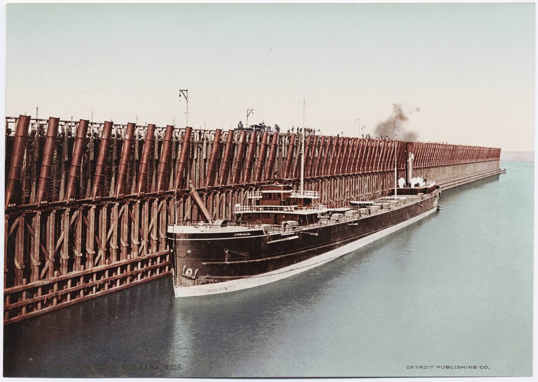 A massive iron ore dock extending out into a Great Lakes harbor