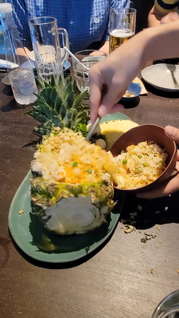Fried rice served in a hollowed pineapple