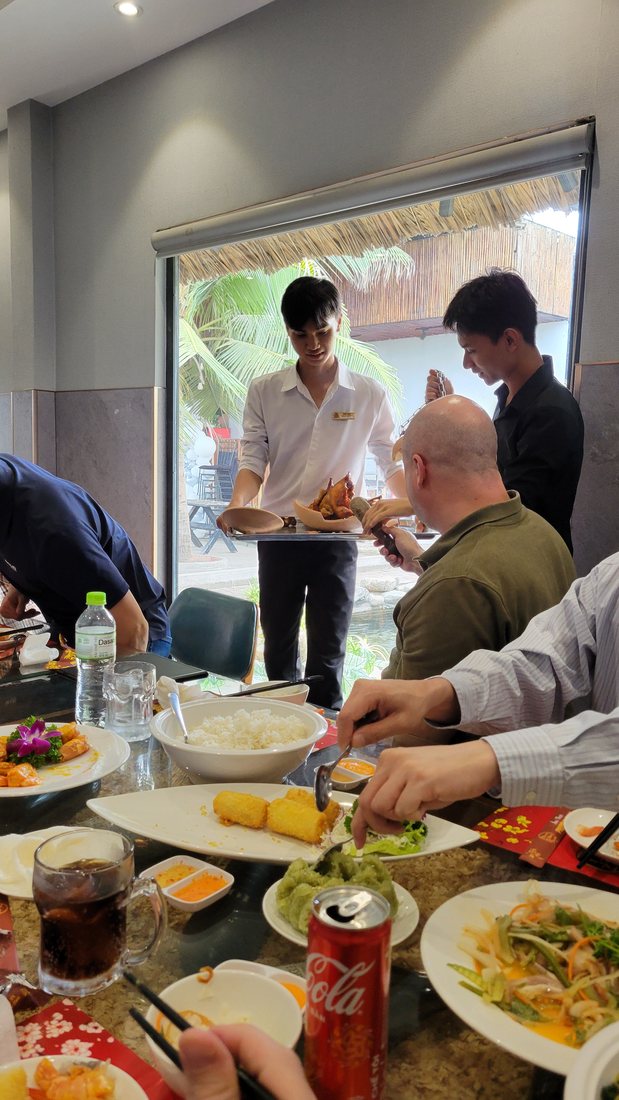 Carving it out at the table afterwards — the chicken comes out of the broken pot and onto a plate in the room