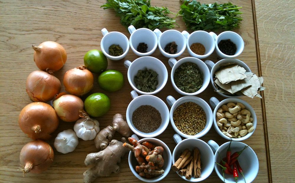 the whole spice lineup for my homemade batch — cloves, allspice, black peppercorns, dried chilies, mustard seed — weighed out in little dishes before they go in (placeholder)